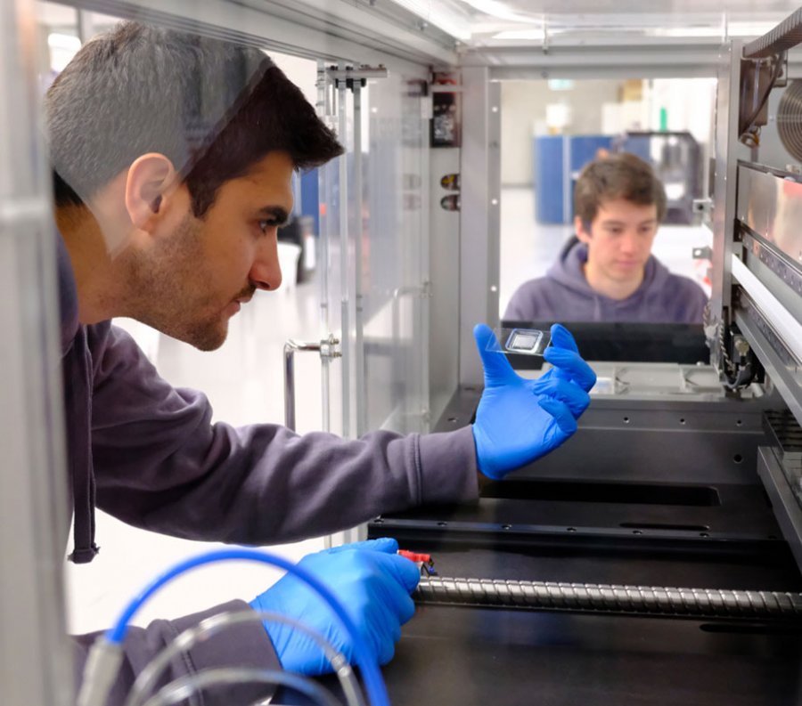 Daniel Nakhaee Zadeh inspecting microfluidic chip to test thousands of AI generated proteins Daniel Nakhaee Zadeh inspecting microfluidic chip to test thousands of AI generated proteins