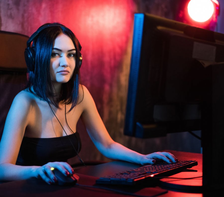 Professional Gamer Girl Playing in First Person Shooter Online Video Game App Developer Magazine
